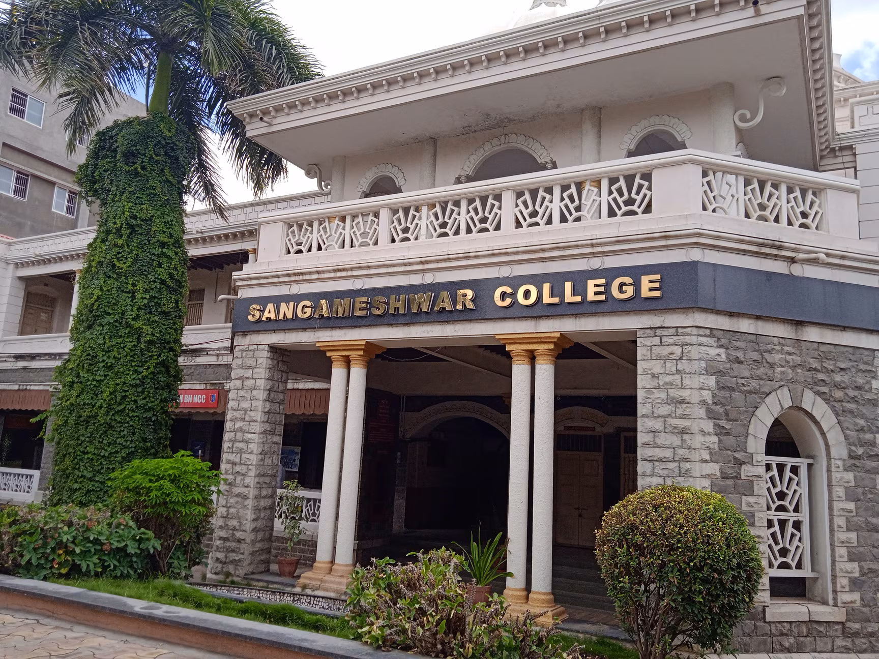 Outdoor event with faculty and cake cutting